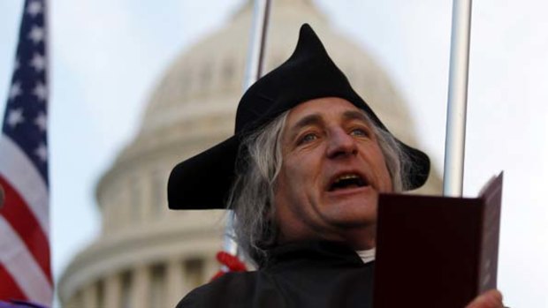 Tea Party supporter James Manship reads from the Declaration of Independence during a flag ceremony in Washington.
