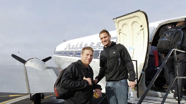 Roughing it ... Crusaders pair Brad Thorn and Andy Ellis prepare to board the DC3.