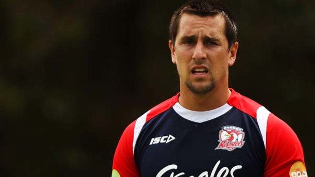 Mitchell Pearce warms up during a Sydney Roosters training session last week.