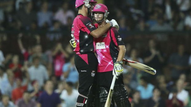 Sydney Sixers stars Steven Smith and Moises Henriques in action last year.