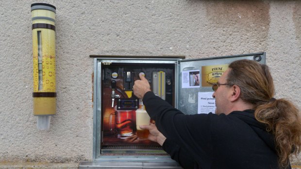 Martin Povysil drafts a beer from his mechanic self-service pub in Uhrinovice village, 130 km far from Prague in central Czech Republic.