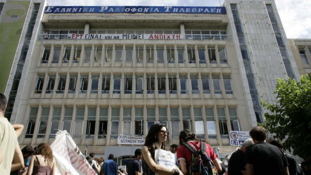 People arrive to support staff occupying the headquarters of the Greek public broadcaster ERT following the announcement of corporations closure on June 12, 2013 in Athens,