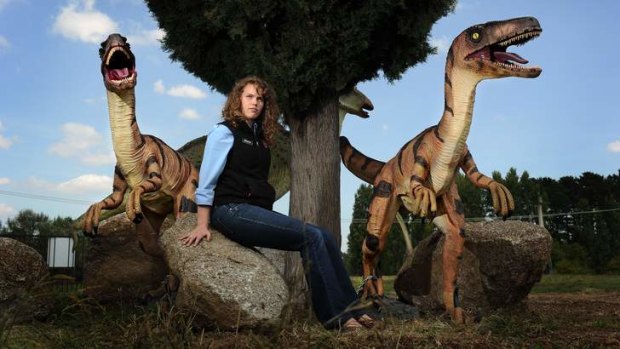 Morgan Burgess from the Dinosaur Museum stands where a raptor dinosaur was stolen last week.