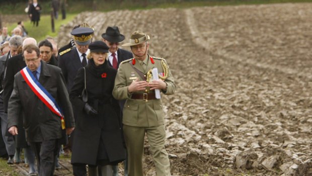 Ms Bryce is escorted to the recently rediscovered burial site of unknown Australian and British soldiers at Fromelles.