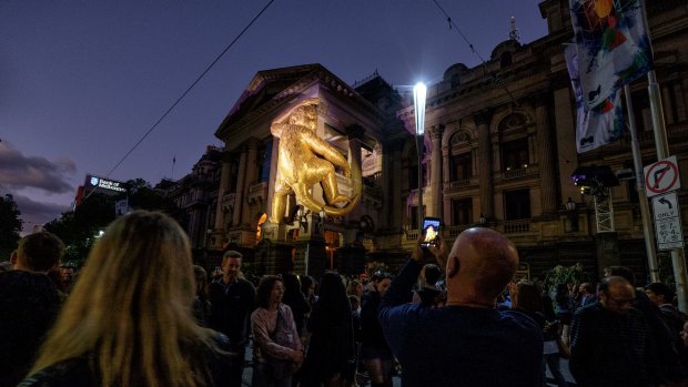 A giant golden monkey clambers up Melbourne Town Hall ... for White Night 2016.