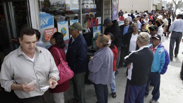 People queue to purchase lottery tickets for the record jackpot, in Lawndale, California.