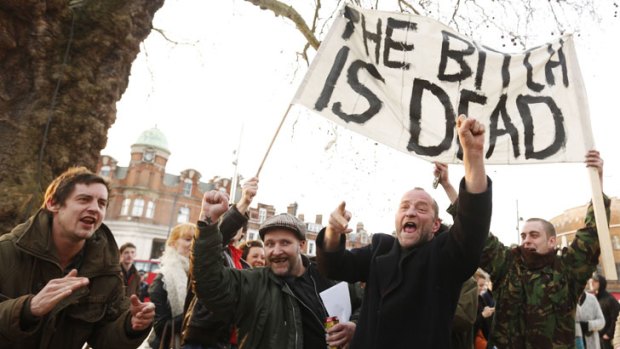 Revellers celebrate the death of Britain's former prime minister Margaret Thatcher at a party in Brixton, south London.