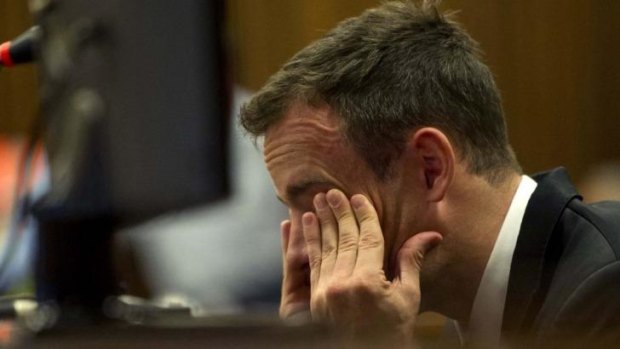 Tearful ... Oscar Pistorius reacts as he listens to evidence by a pathologist in court in Pretoria, South Africa.