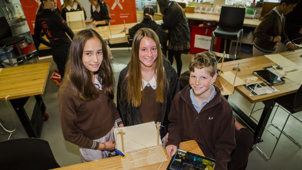 STEM-themed learning opportunities for young Australians at  The Ian Potter Foundation Technology Learning Centre.
Karabar High School students, from left, Dhiaan Sidhu, 13, Lyza Cross, 14, and Angus Leslie, 13, building a bridge design with a Samsung tablet, then modelling it in real life. 

