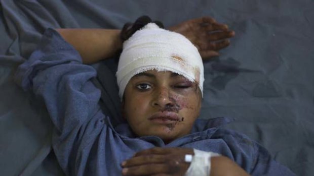 Injured in the blast... 12-year-old Ajmal waits in hospital for treatment.