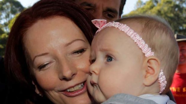 The baby kissing began for Prime Minister Julia Gillard on the first day of campaigning.