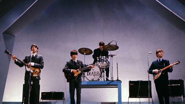 The Beatles ... Paul McCartney, left, George Harrison, second left, Ringo Starr, second right, and John Lennon, right, on stage during a concert in London on July 29, 1965.