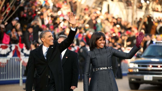 Barack and Michelle Obama walk the route as the presidential inaugural parade winds through the nation's capital.