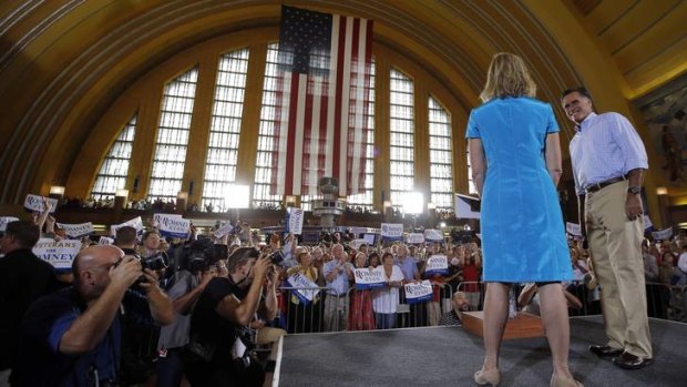 Mitt Romney and his wife, Ann, address supporters a campaign rally in Cincinnati, Ohio, on Saturday.