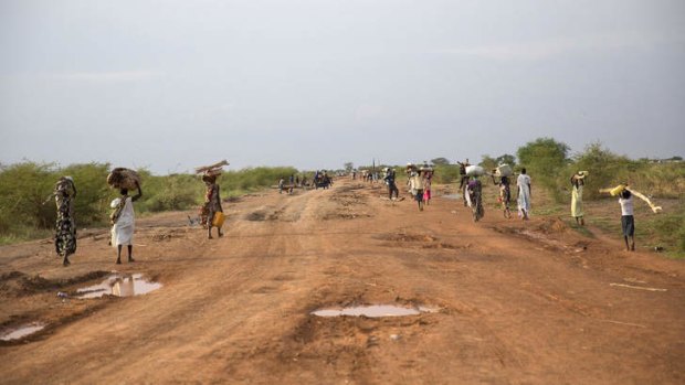 Running for the lives: Civilians flee from renewed attacks in Bentiu.