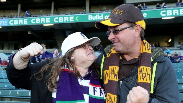 Mock rage: A Fremantle fan and Hawthorn fan face off before Friday night's match.