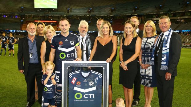 Leigh Broxham of the Victory poses for a photo after a presentation to mark his 200th game.