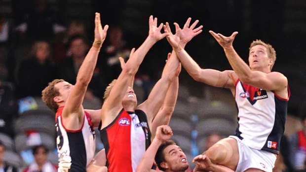 On the rise: Ricky Petterd (right) outleaps St Kilda's Sam Fisher on Saturday, but Etihad Stadium is not a happy hunting ground for Melbourne.