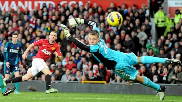 Manchester United's Tom Cleverley scores past Sunderland goalkeeper Simon Mignolet.