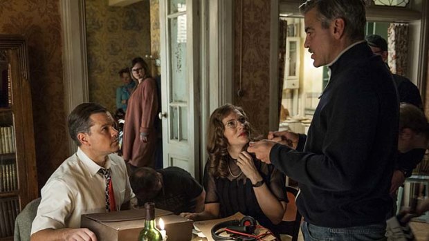 Getting it right: Matt Damon, Cate Blanchett and George Clooney discuss a scene.