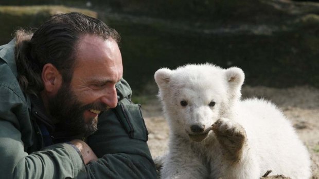 Berlin zoo employee Thomas Doerflein plays with polar bear cub Knut  in 2007.