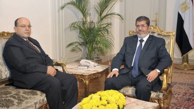 Mohamed Mursi, right, with Egypt's new prosecutor general, Talaat Ibrahim Abdullah, after sacking his predecessor.
