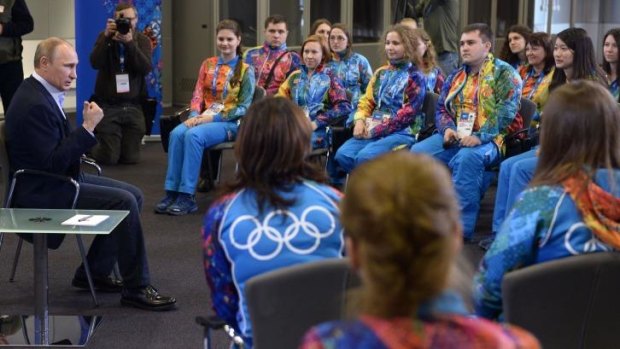 Rainbow nation: Russian President Vladimir Putin speaks to Olympic volunteers in Sochi on Friday.