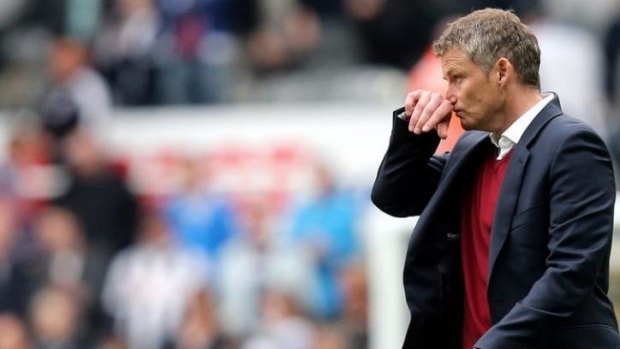Dejected: Cardiff City's manager Ole Gunnar Solskjaer after his club was relegated by Newcastle United.