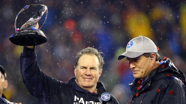 Head coach Bill Belichick of the New England Patriots holds up the Lamar Hunt Trophy after defeating the Indianapolis Colts in the 2015 AFC Championship Game on January 18 in Foxboro, Massachusetts. 