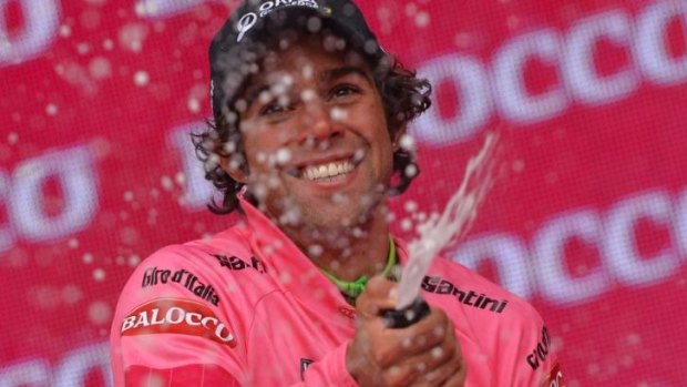 Michael Matthews celebrates after clinching the overall leader's pink jersey at the end of the second stage of the Giro d'Italia.