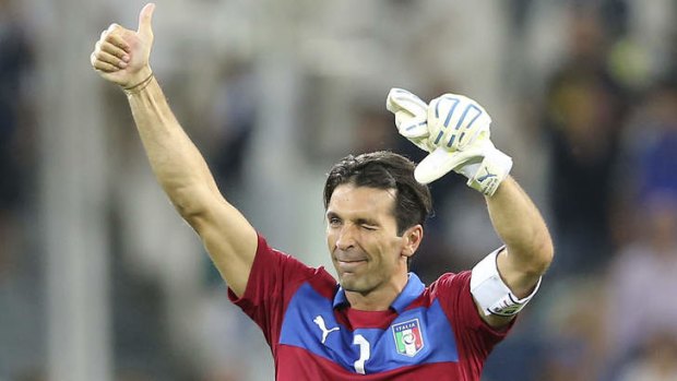 Off to Rio: Veteran Italy keeper Gianluigi Buffon salutes fans after helping the Azzuri book a spot in the 2014 World Cup.
