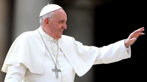 Not a film buff: Pope Francis waves to the faithful as he holds his weekly audience in St Peter's Square.