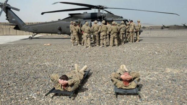 Less need for so many land-based troops: US soldiers in Afghanistan practise medical evacuations.