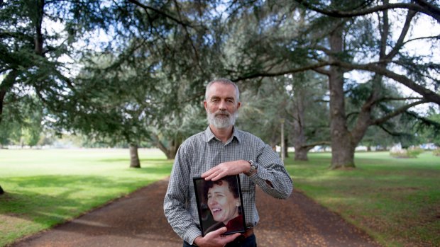 Brendan Moran, holding a photograph is his wife Angie Parker.  'Conversations at the end of life' - documenting the final months of Angie's life. Photo Jay Cronan