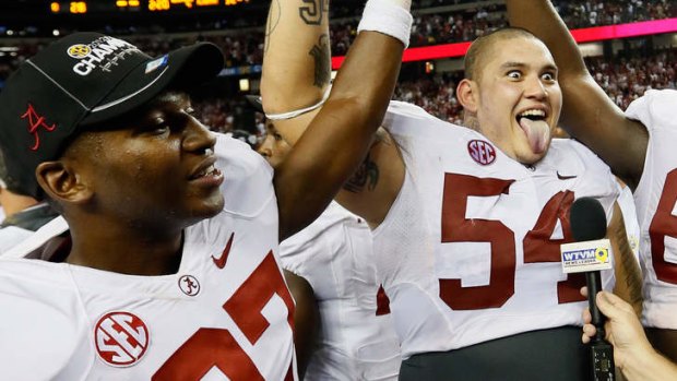 Former Alabama star Jesse Williams (right) is on track to be picked up in the first round of April's NFL draft.
