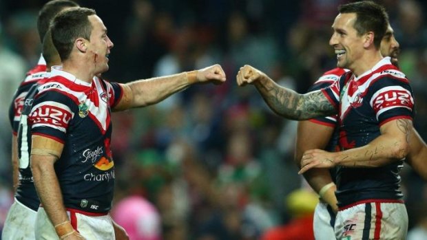 Money talks: James Maloney and Mitchell Pearce of the Roosters.