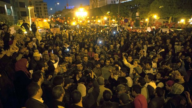 Tunisians gather at Habib Bourguiba avenue to show solidarity with the victims of the attack at a museum in Tunis on Wednesday.