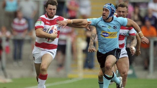 On the run: London Broncos five-eighth Jamie Soward chases Darrell Goulding in the Challenge Cup semi-final.