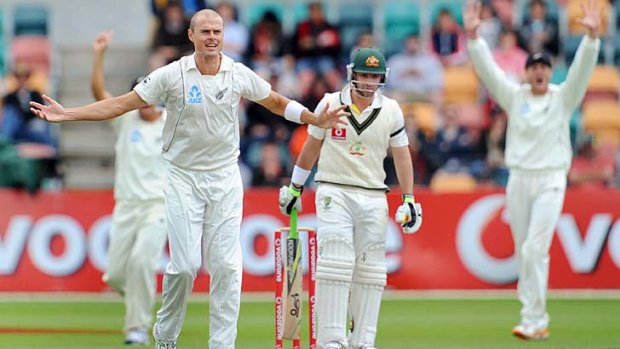 New Zealand's Chris Martin (L) appeals for a decision against Australian batsman Phillip Hughes in Hobart.