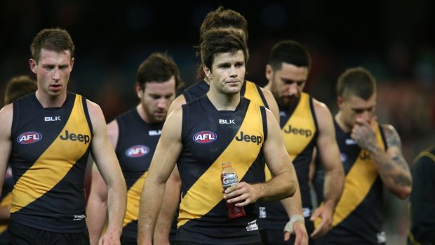 Richmond players leave the ground after another loss, this time to Sydney in round 14.