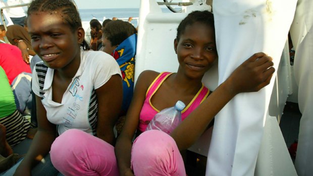 Asylum seekers on Lampedusa rescued from a leaking boat carrying 300 people.