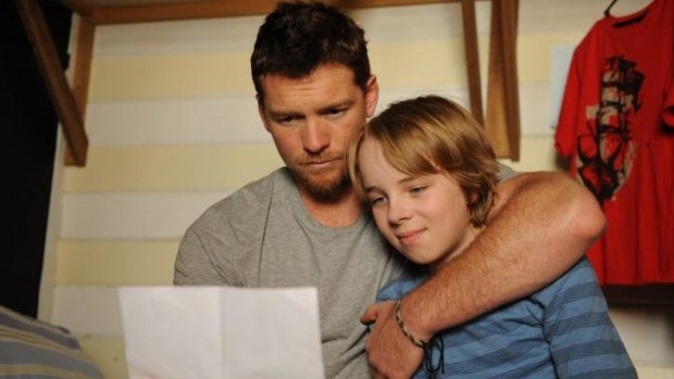Great news: Sam Worthington and Ed Oxenbould.