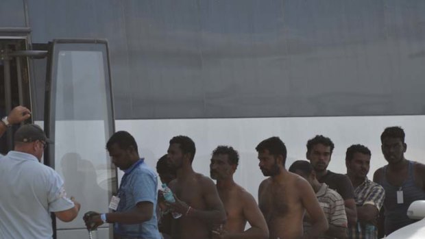 Asylum seekers arrive on Christmas Island yesterday.