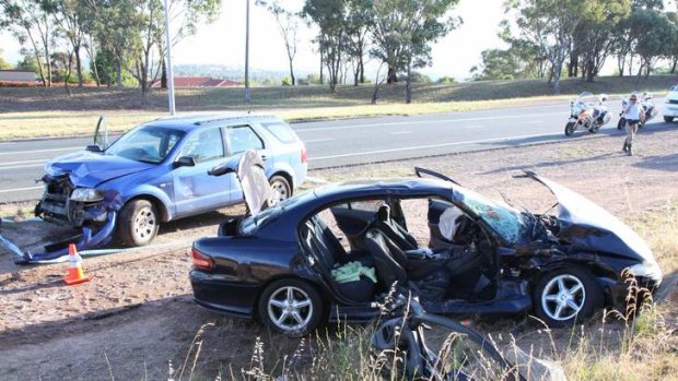 A seriously injured man was trapped inside his burning vehicle after it was hit by the driver of a stolen car in Kambah.