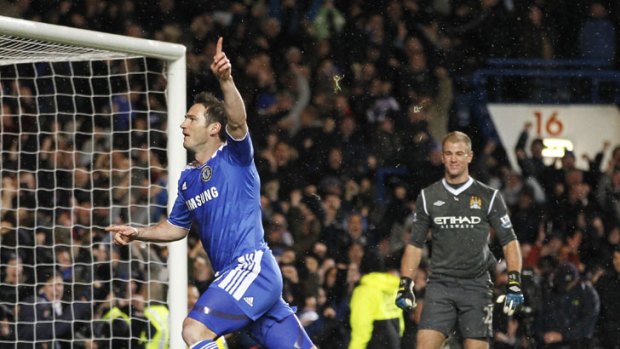 Blue heaven: Chelsea's Frank Lampard celebrates his penalty goal against Manchester City.