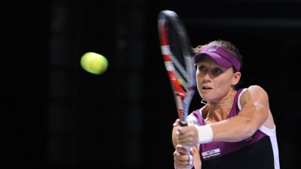 Samantha Stosur returns against Petra Kvitova during their Istanbul WTA tennis championship match.