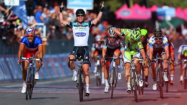 Did his homework: Great Britain's Mark Cavendish from team Omega Pharma - Quick-Step celebrates as he crosses the finish line to win stage one of the 2013 Giro D'Italia in Naples.