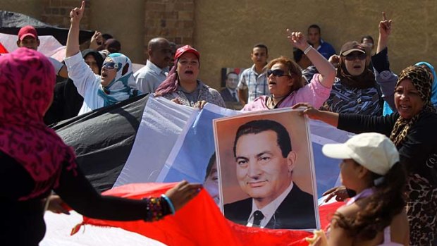 Supporters of Hosni Mubarak protest in Cairo this week.