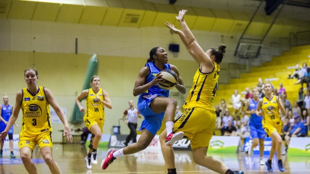 WNBL deserves TV exposure: Canberra's Renee Montgomery drives to the hoop against Sydney Uni Flames.