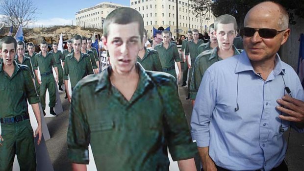 Noam Shalit stands near cardboard cut-outs of his son, captured Israeli soldier Gilad Shalit, during a protest calling for his release in 2009.